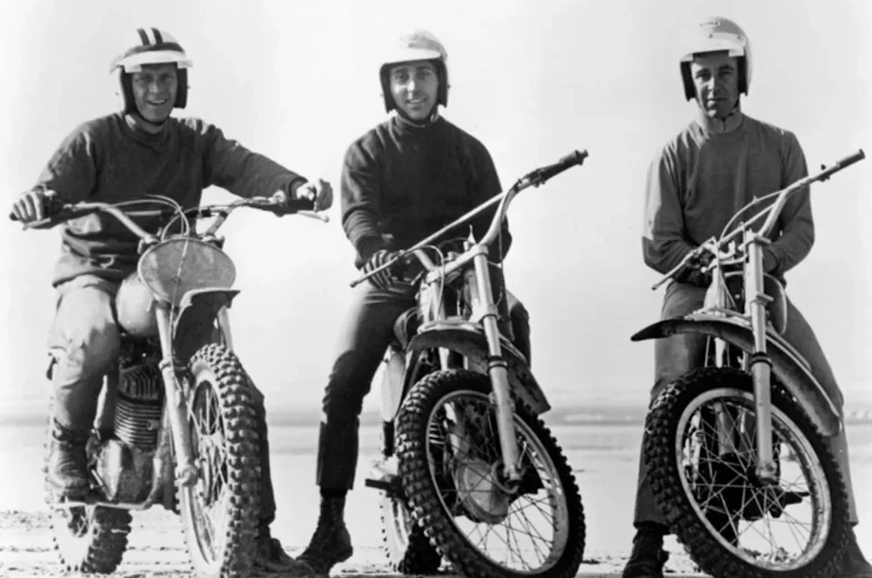 three motorcyclists in riding gear on dirt bikes